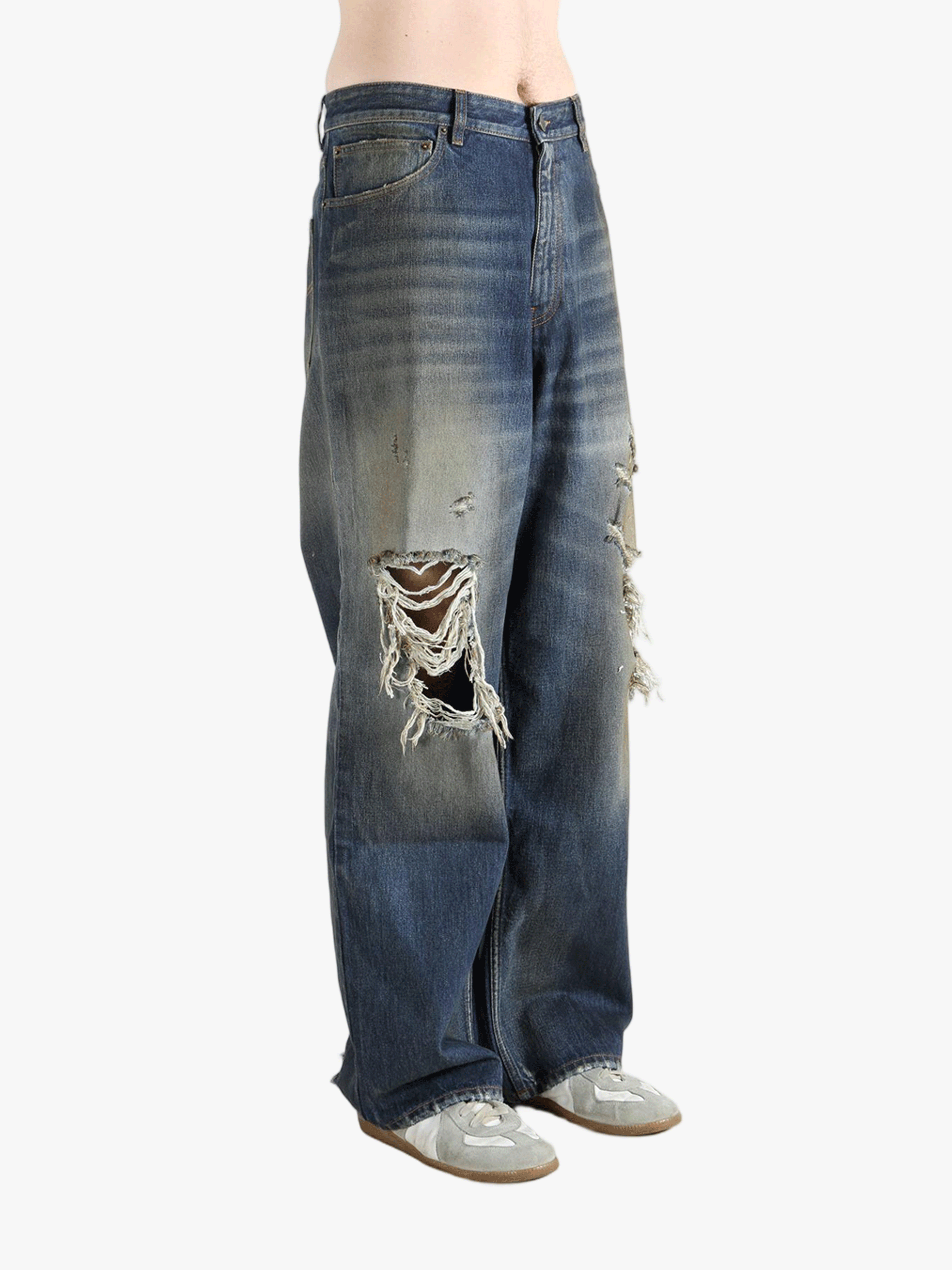 blue jeans worn by a person, showing the  jeans fit