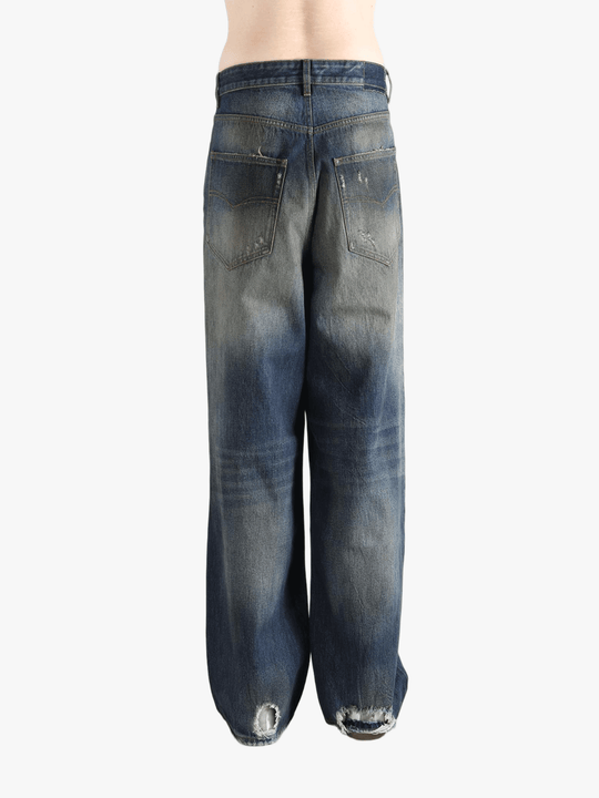 blue jeans worn by a person, showing the  jeans fit