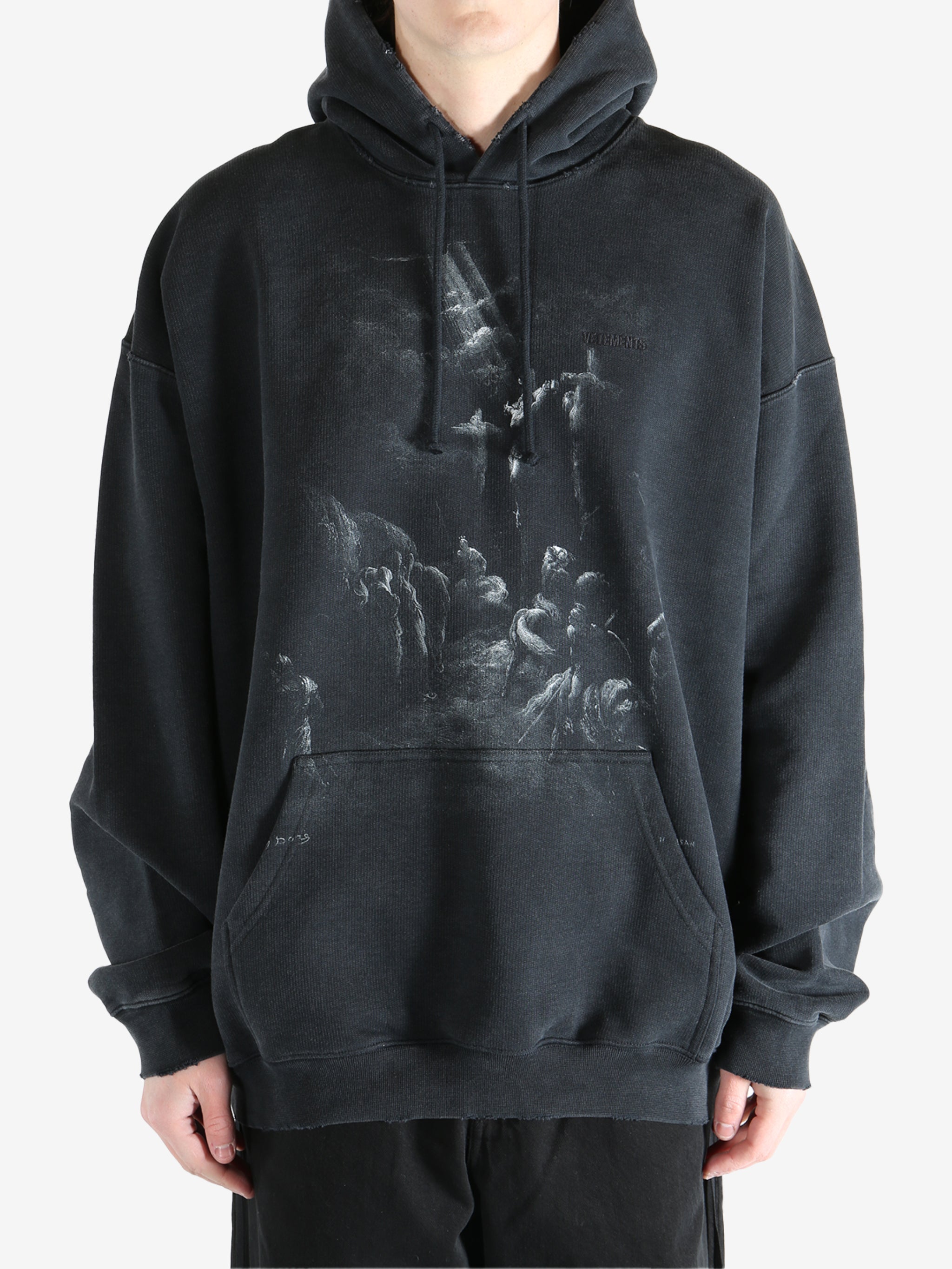 Black hoodie worn by a person, showing the hoodie fit