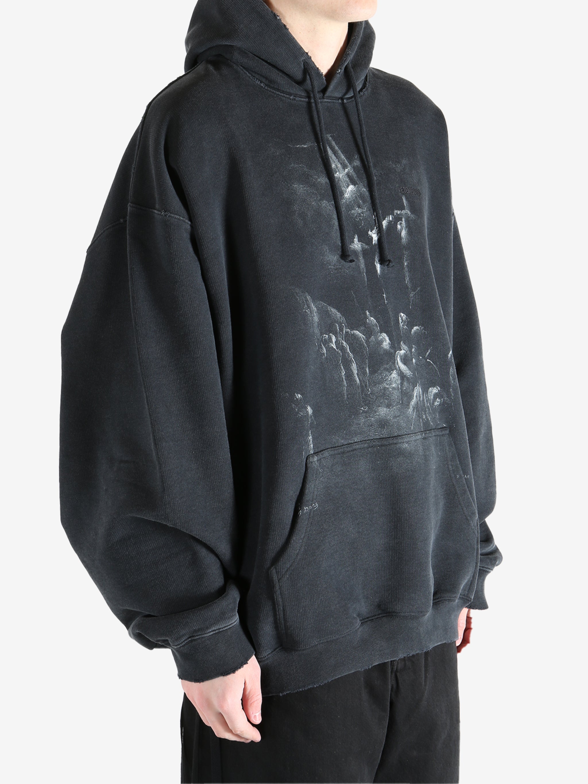 Black hoodie worn by a person, showing the hoodie fit