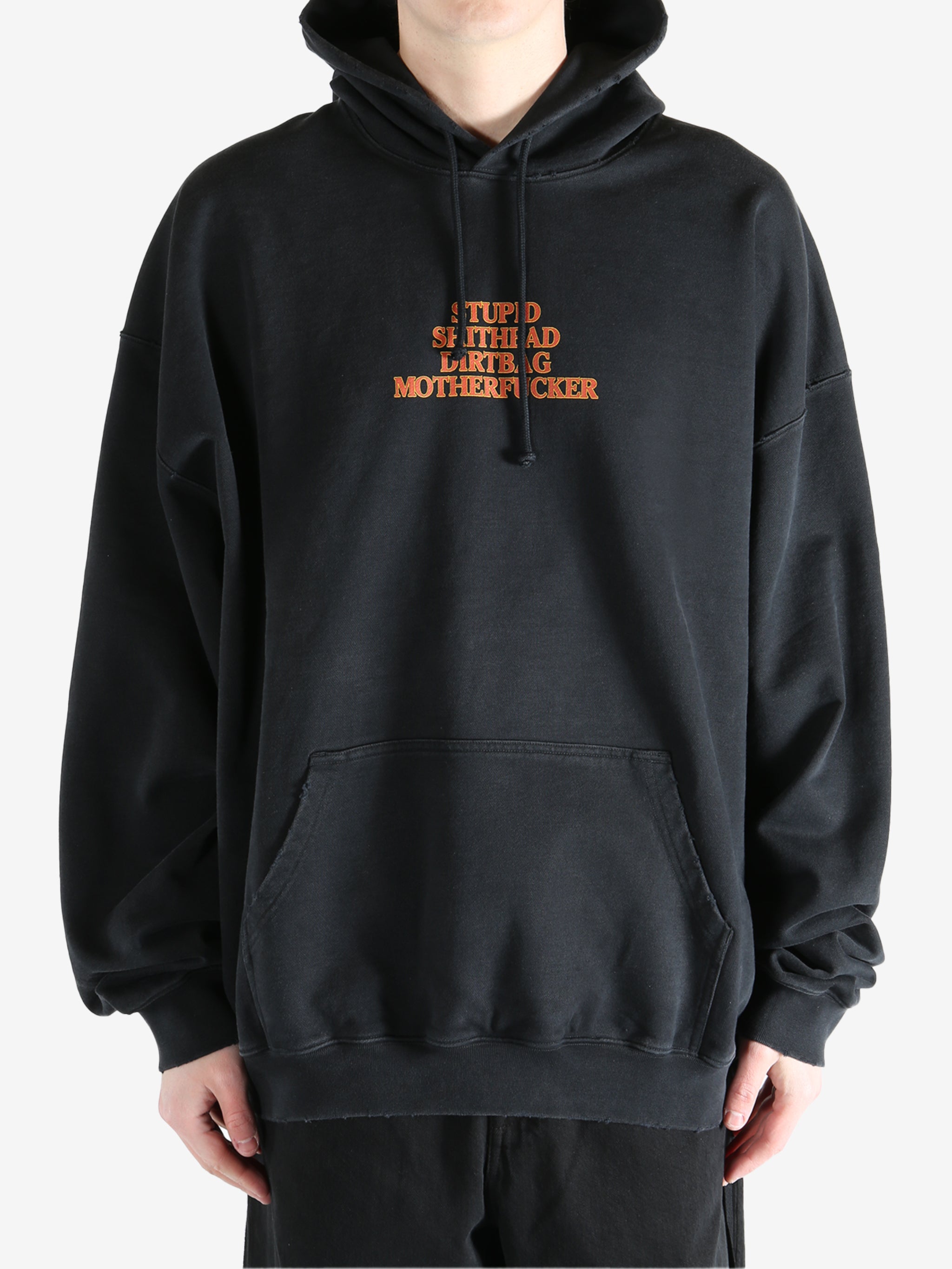 Black hoodie worn by a person, showing the hoodie's fit