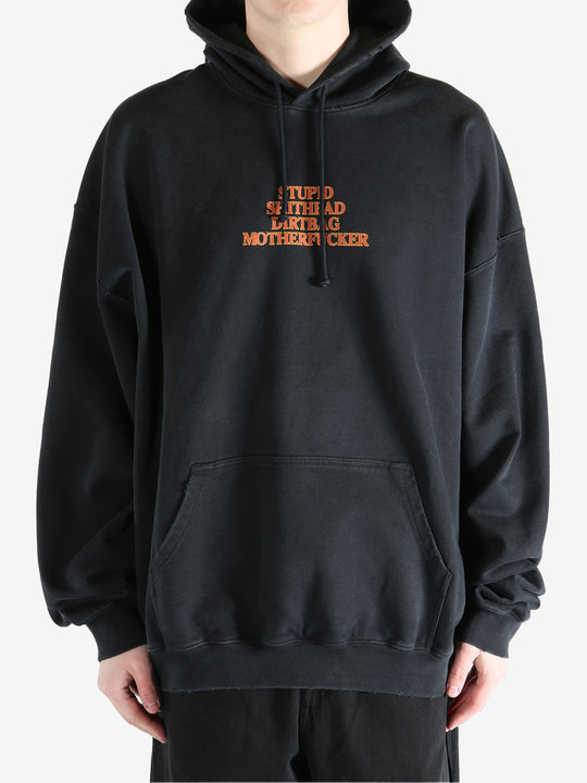 Black hoodie worn by a person, showing the hoodie's fit