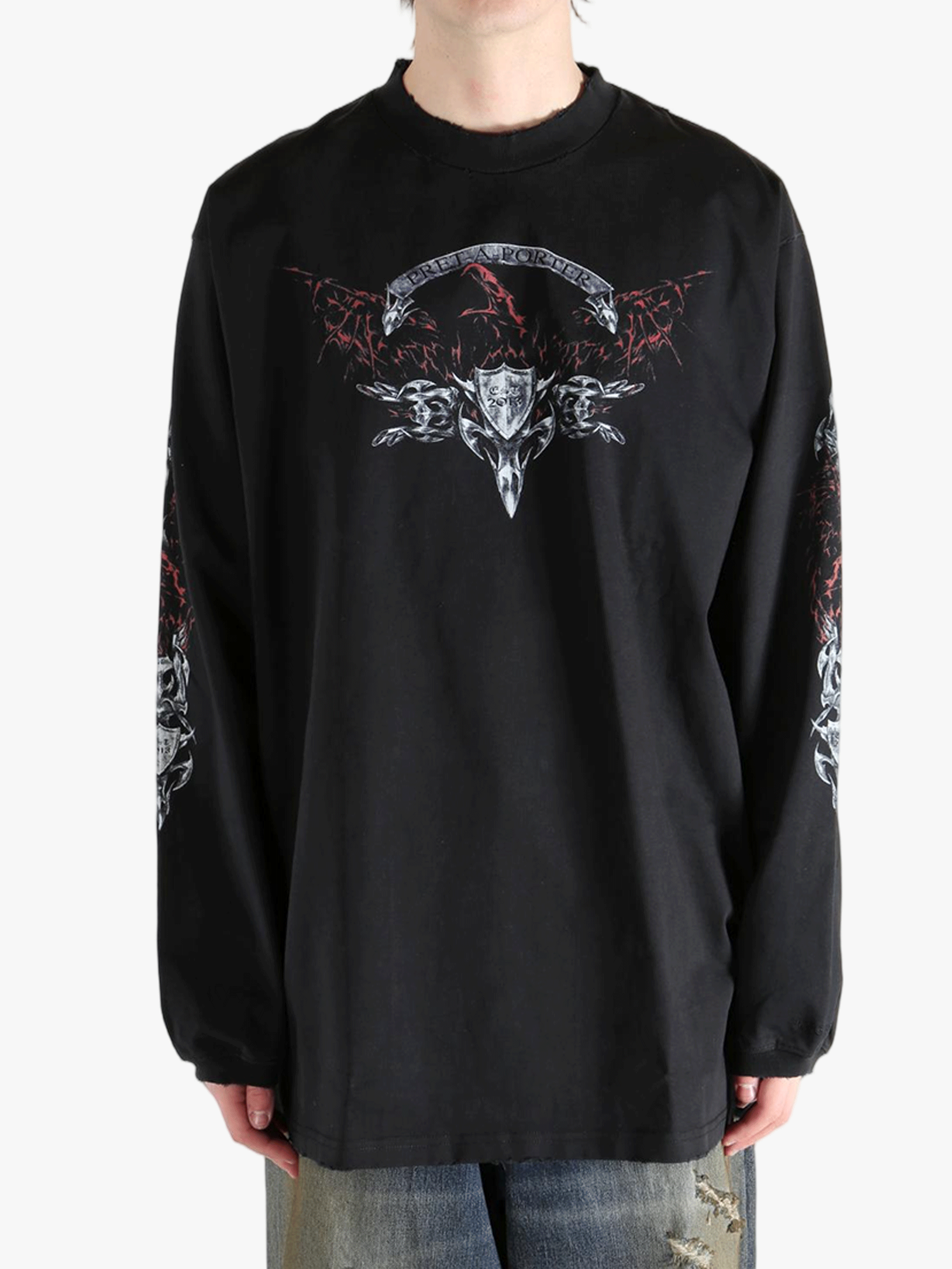 Black shirt worn by a person, showing the  shirt fit