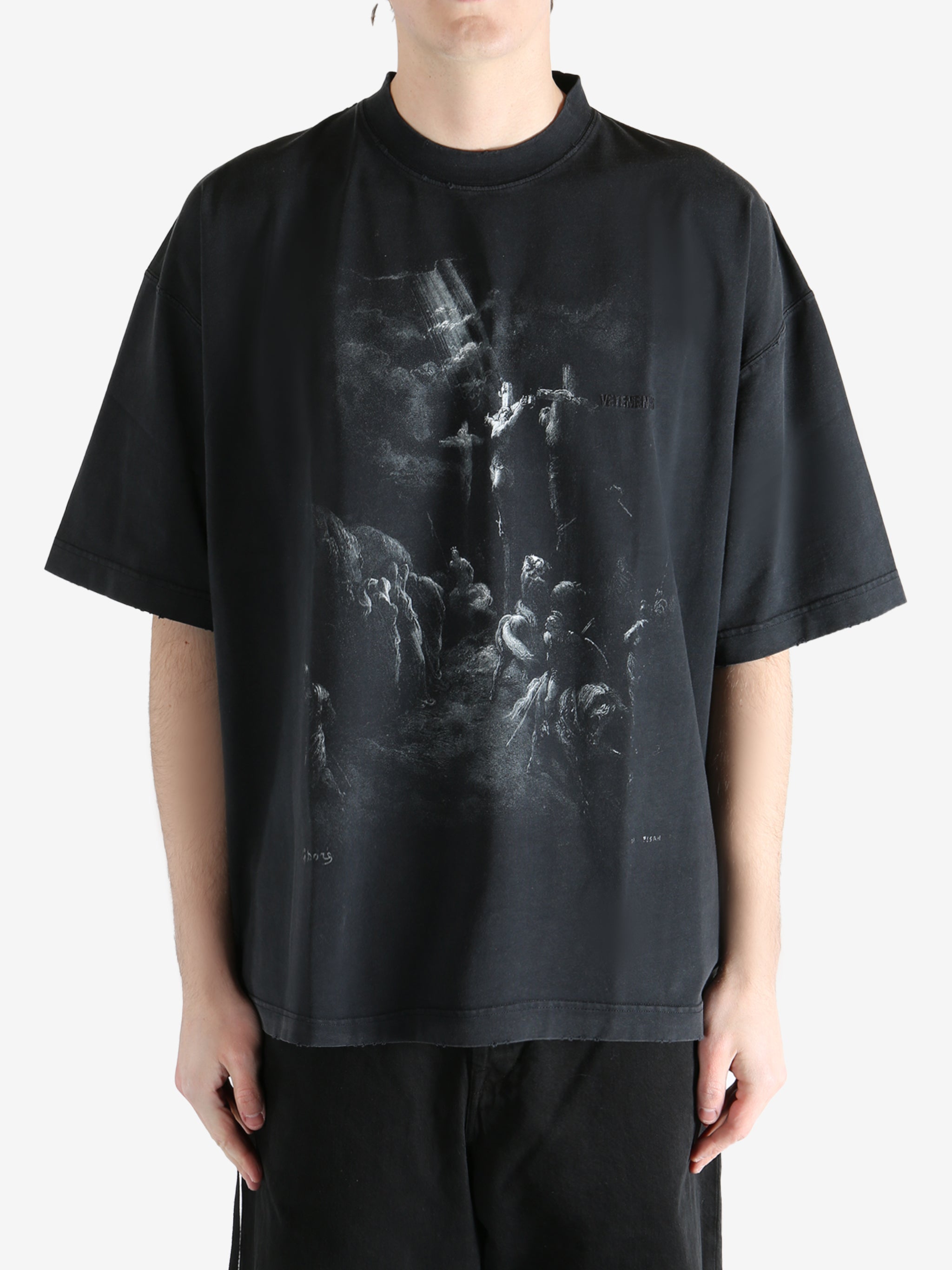 Blcak T-shirt worn by a person, showing the T-shirt fit