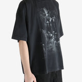 Blcak T-shirt worn by a person, showing the T-shirt fit