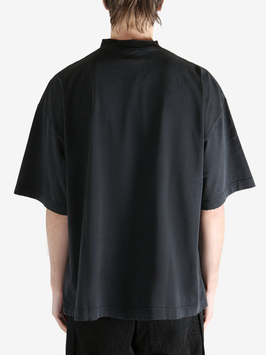 Blcak T-shirt worn by a person, showing the T-shirt fit