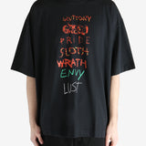 Black T-shirt worn by a person, showing the shirt fit