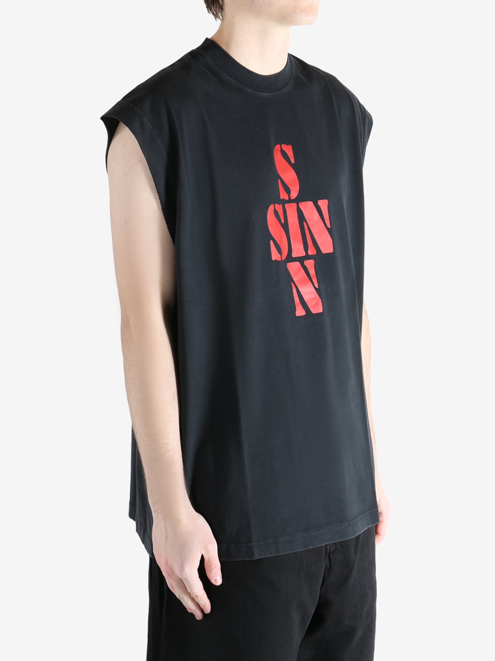 Black T-shirt worn by a person, showing the T-shirt fit