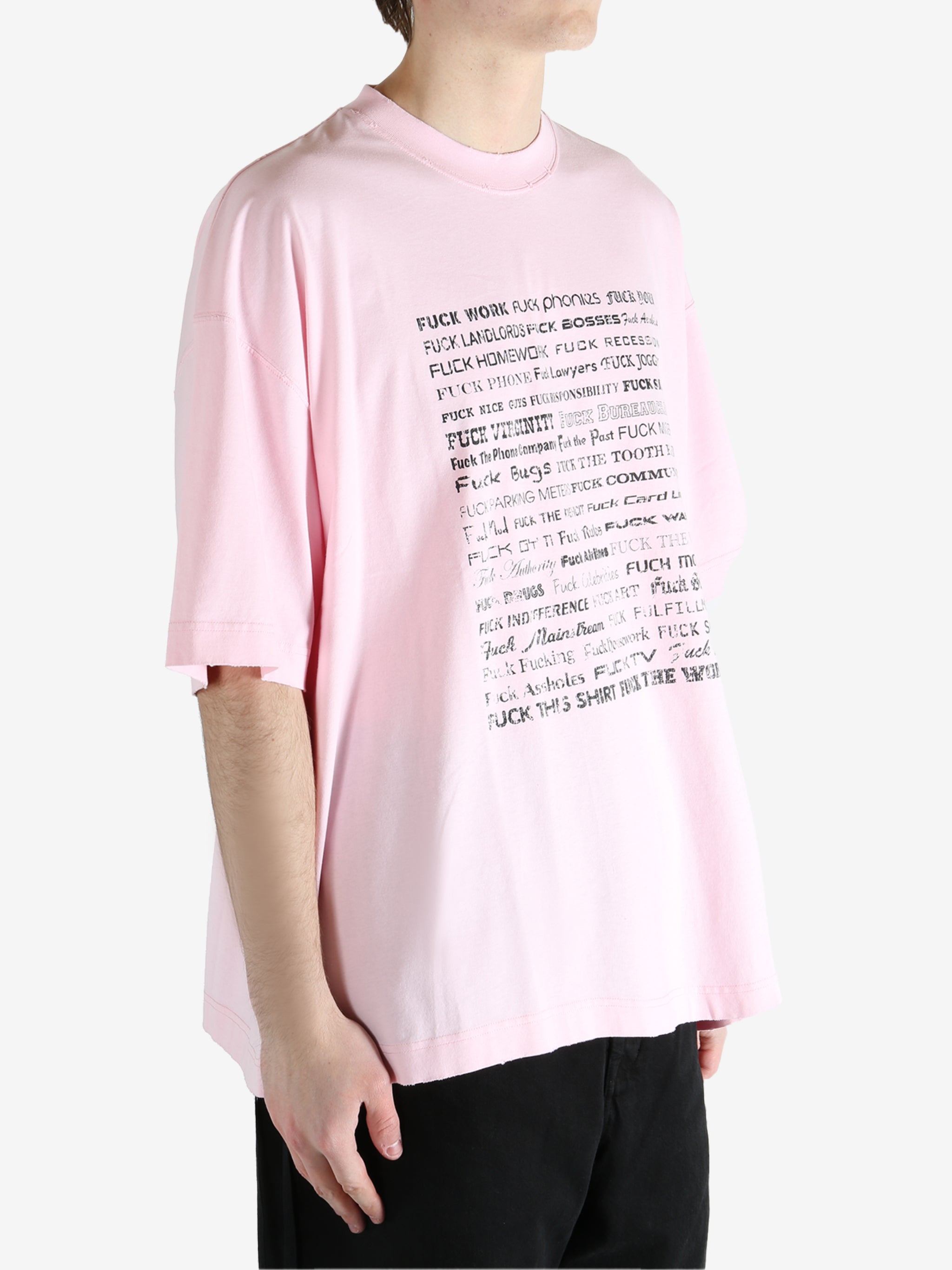 Pink T-shirt worn by a person, showing the T-shirt fit