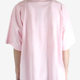 Pink T-shirt worn by a person, showing the T-shirt fit