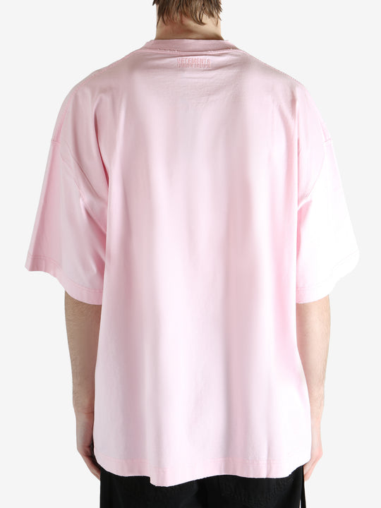 Pink T-shirt worn by a person, showing the T-shirt fit