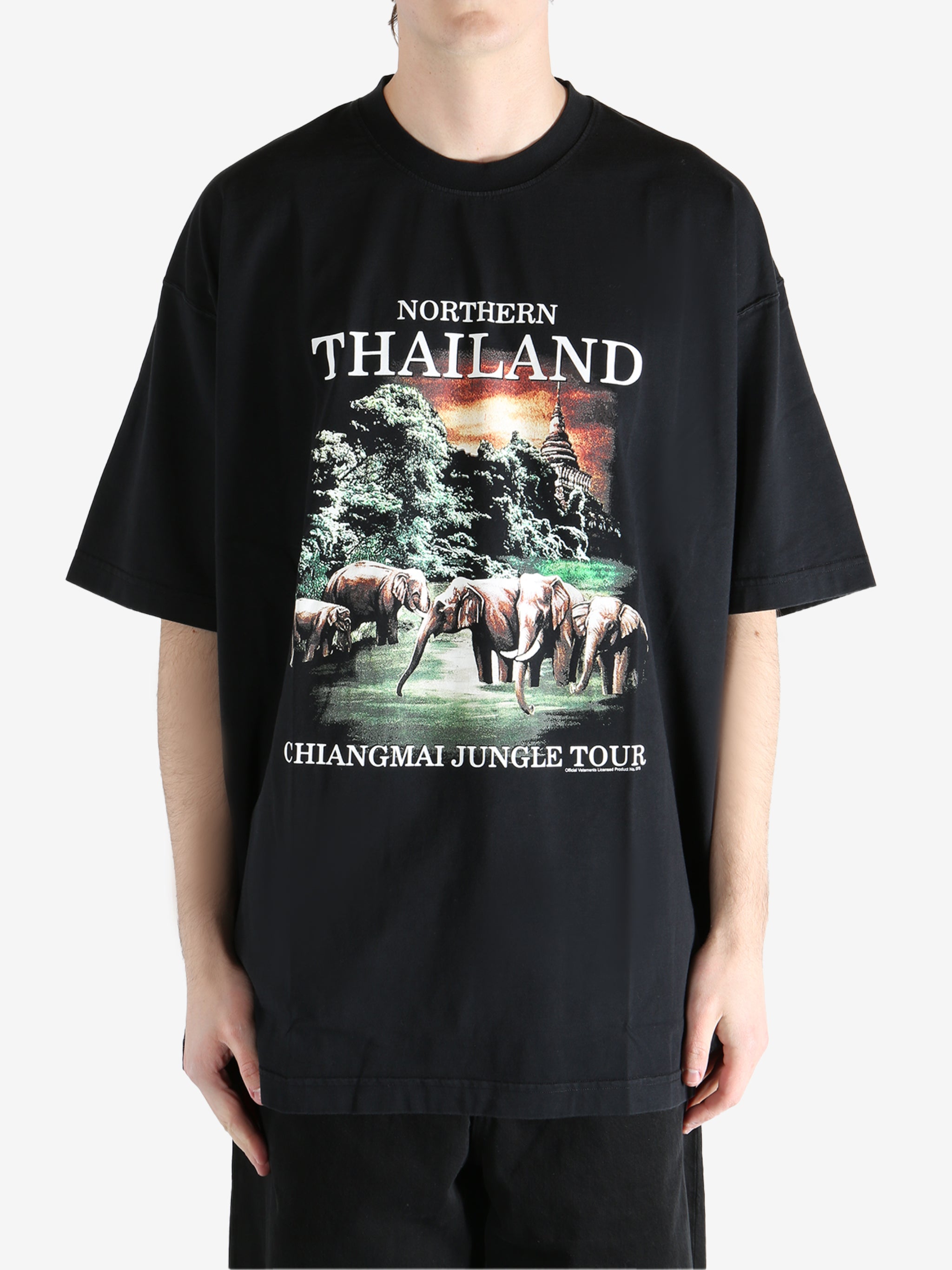 Black T-shirt worn by a person, showing the T-shirt fit