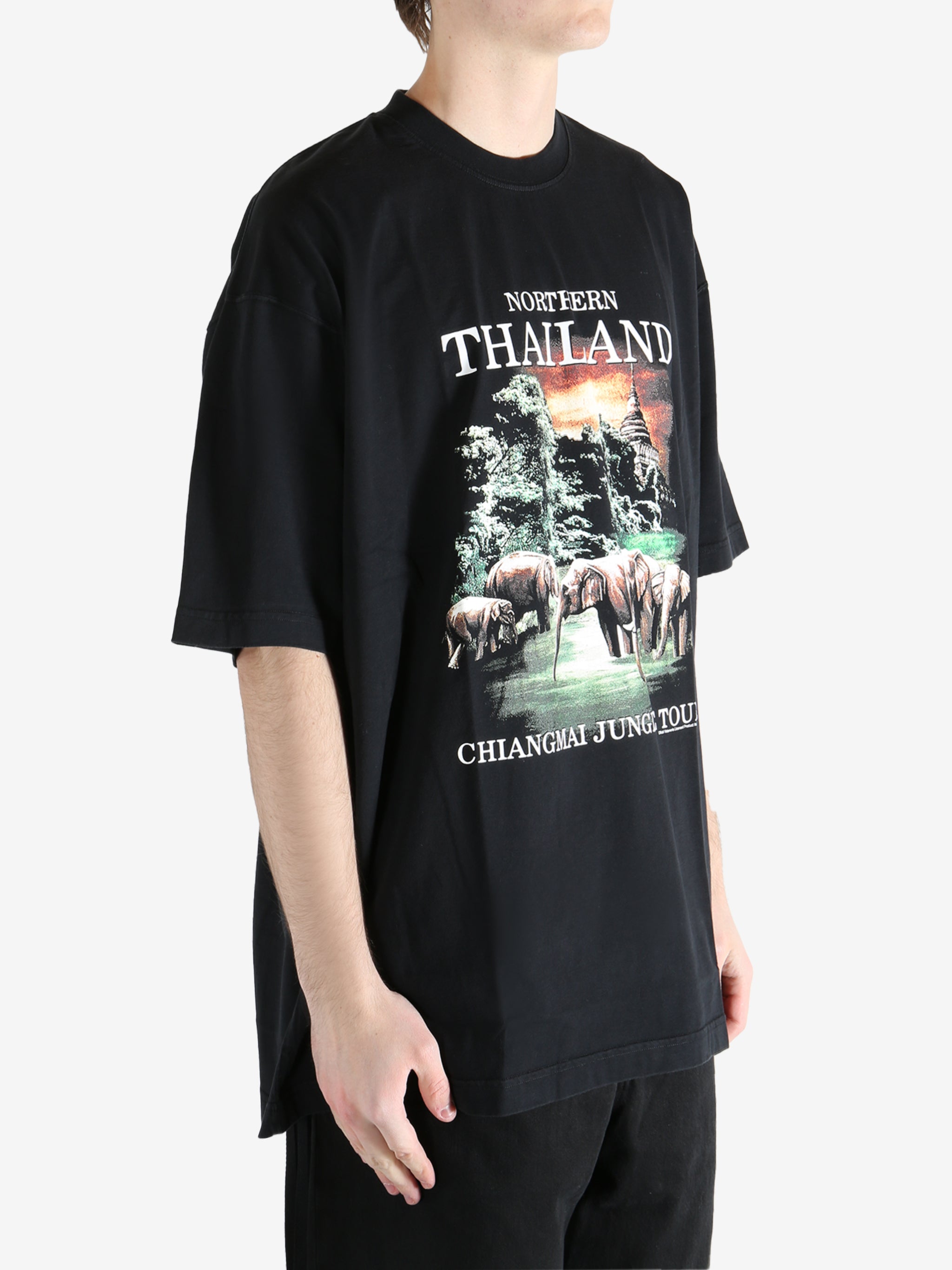 Black T-shirt worn by a person, showing the T-shirt fit