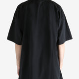 Black T-shirt worn by a person, showing the T-shirt fit