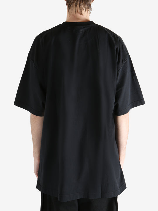 Black T-shirt worn by a person, showing the T-shirt fit
