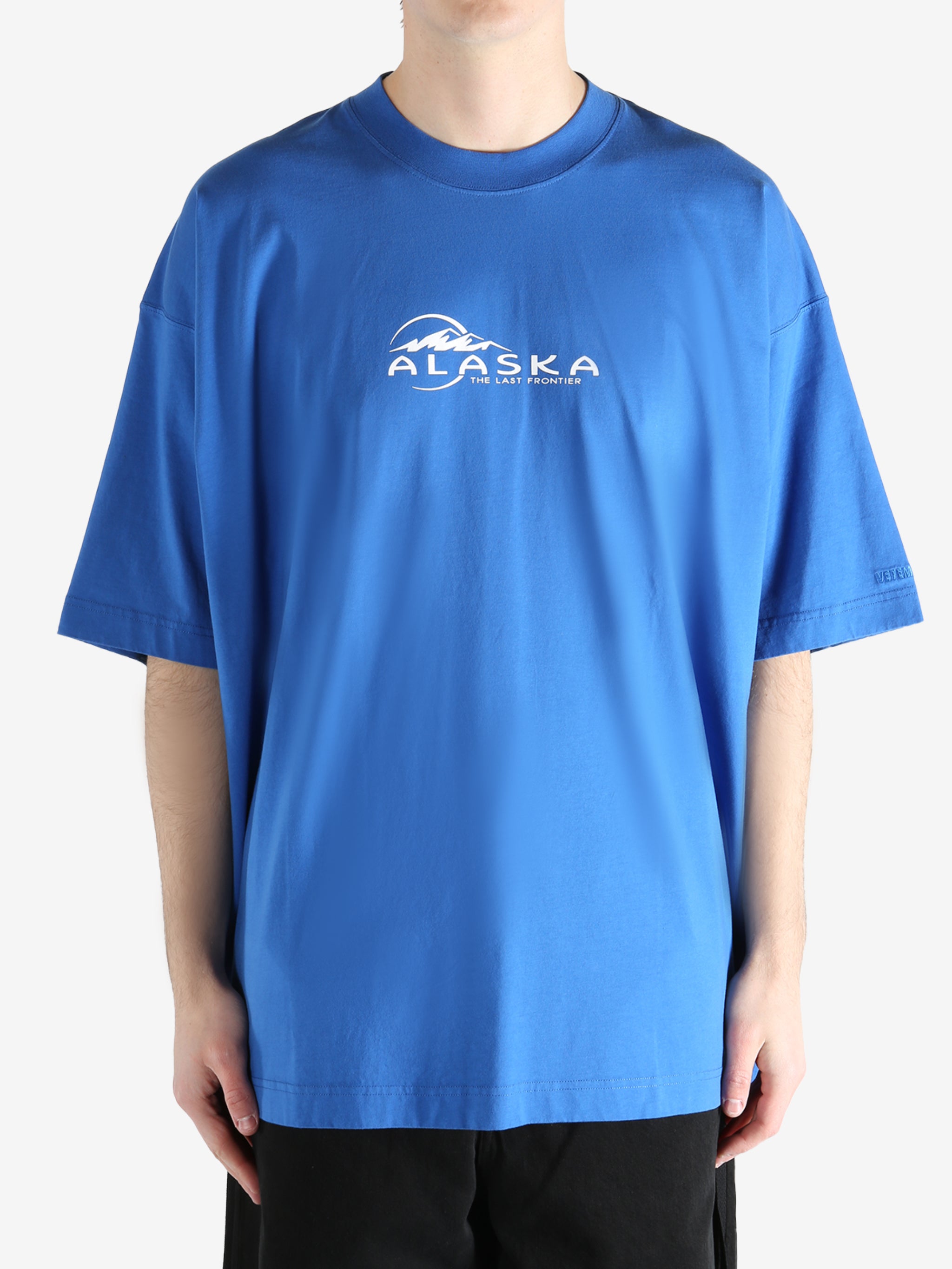 Blue T-shirt worn by a person, showing the T-shirt fit