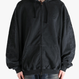Black hoodie worn by a person, showing the hoodie fit