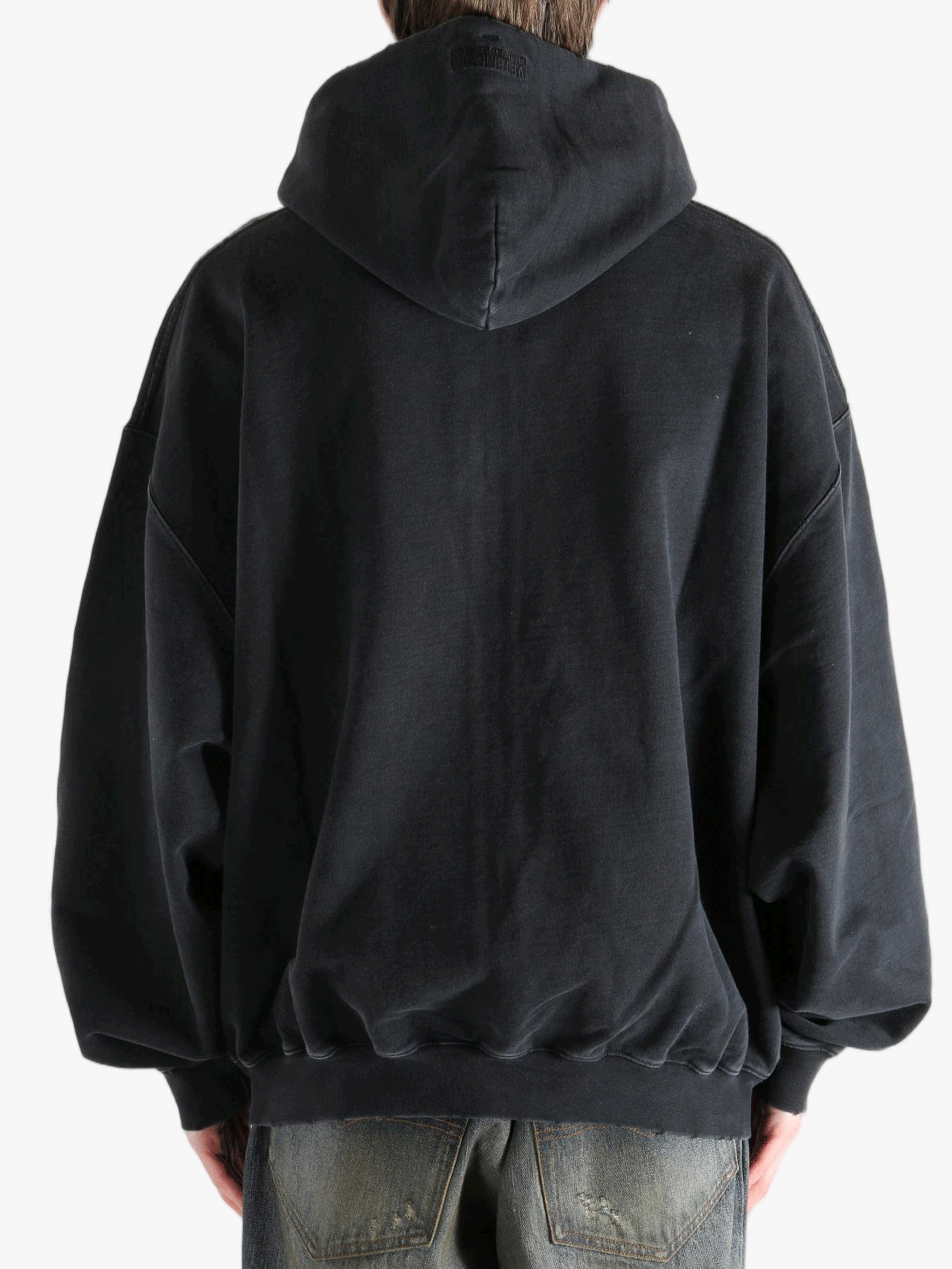 Black hoodie worn by a person, showing the hoodie fit