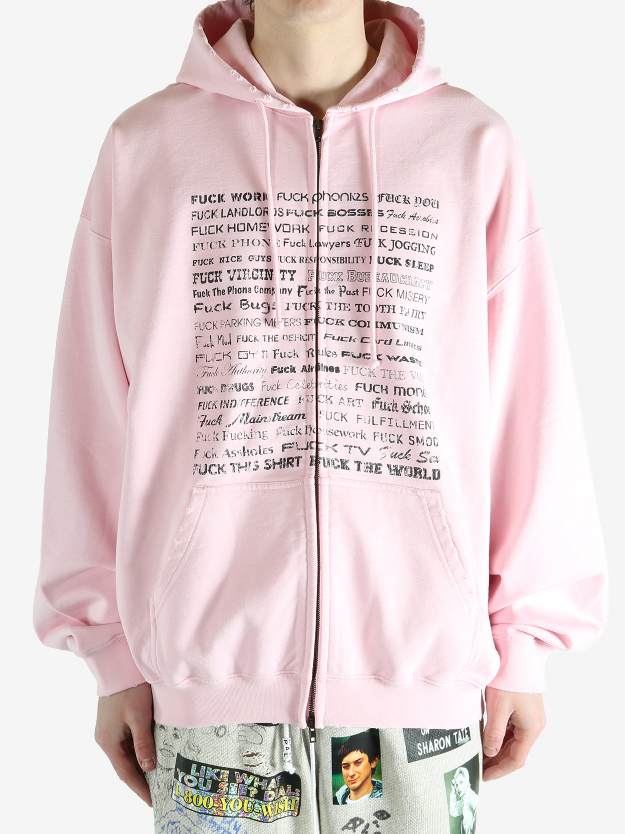Pink hoodie worn by a person, showing the hoodie fit