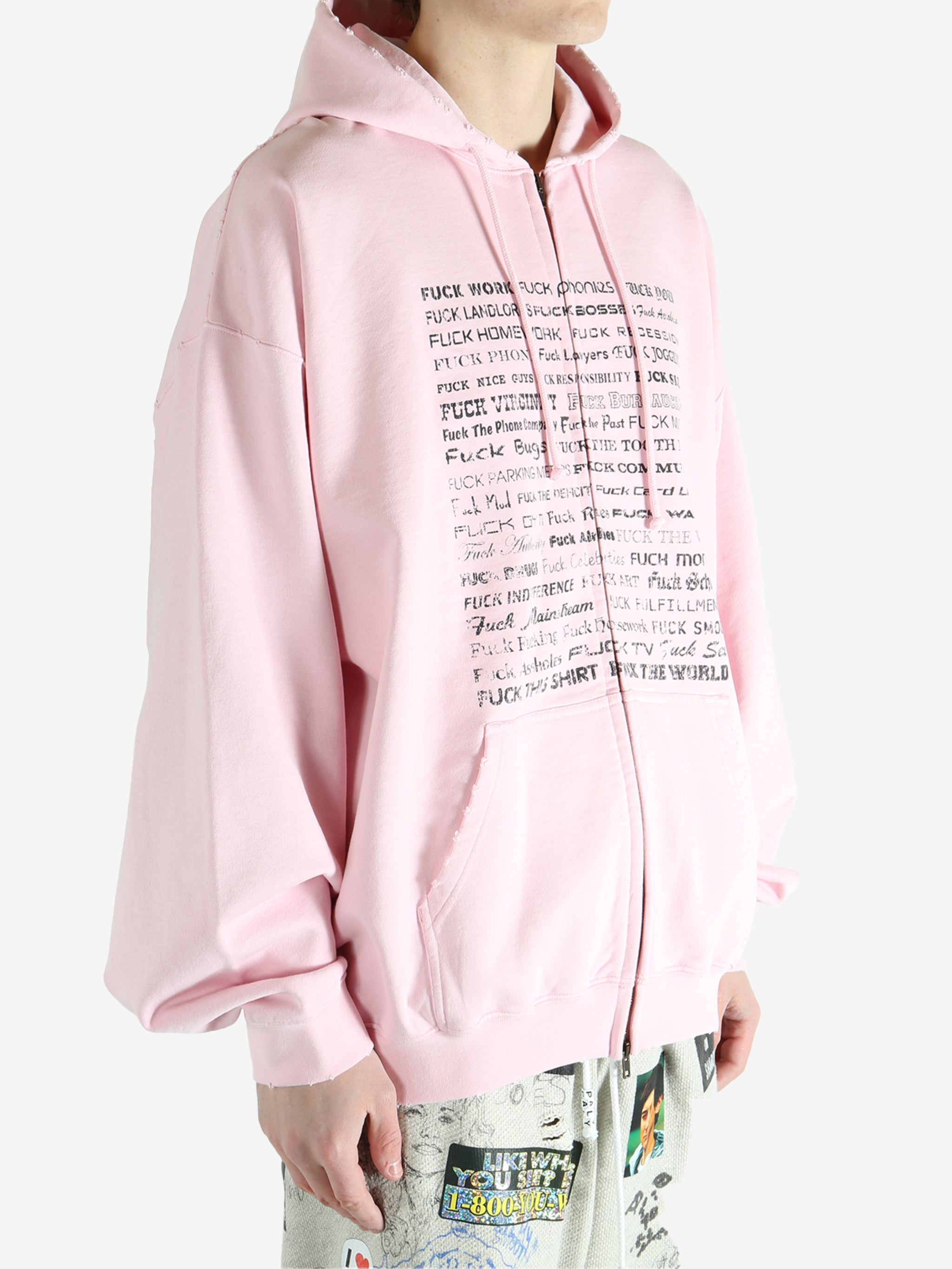 Pink hoodie worn by a person, showing the hoodie fit