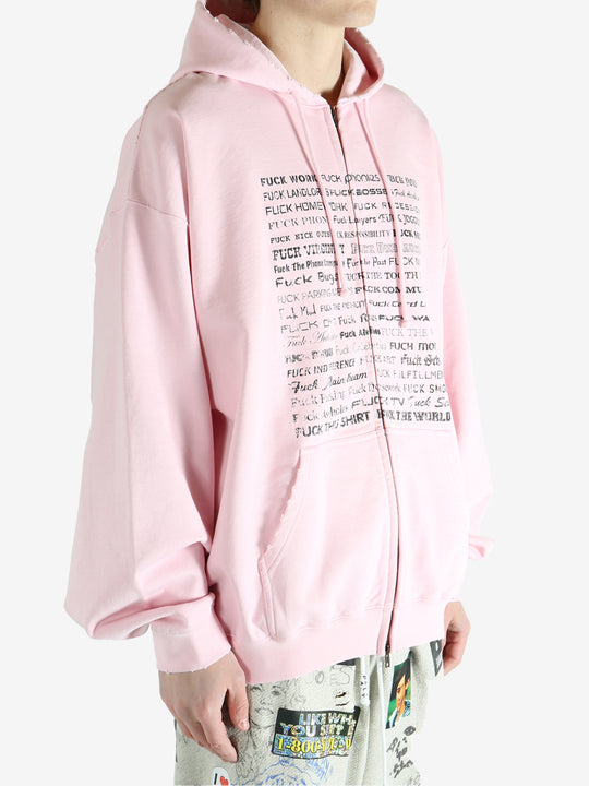 Pink hoodie worn by a person, showing the hoodie fit