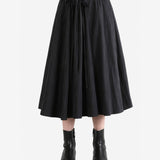 Black skirt worn by a person, showing the skirt fit