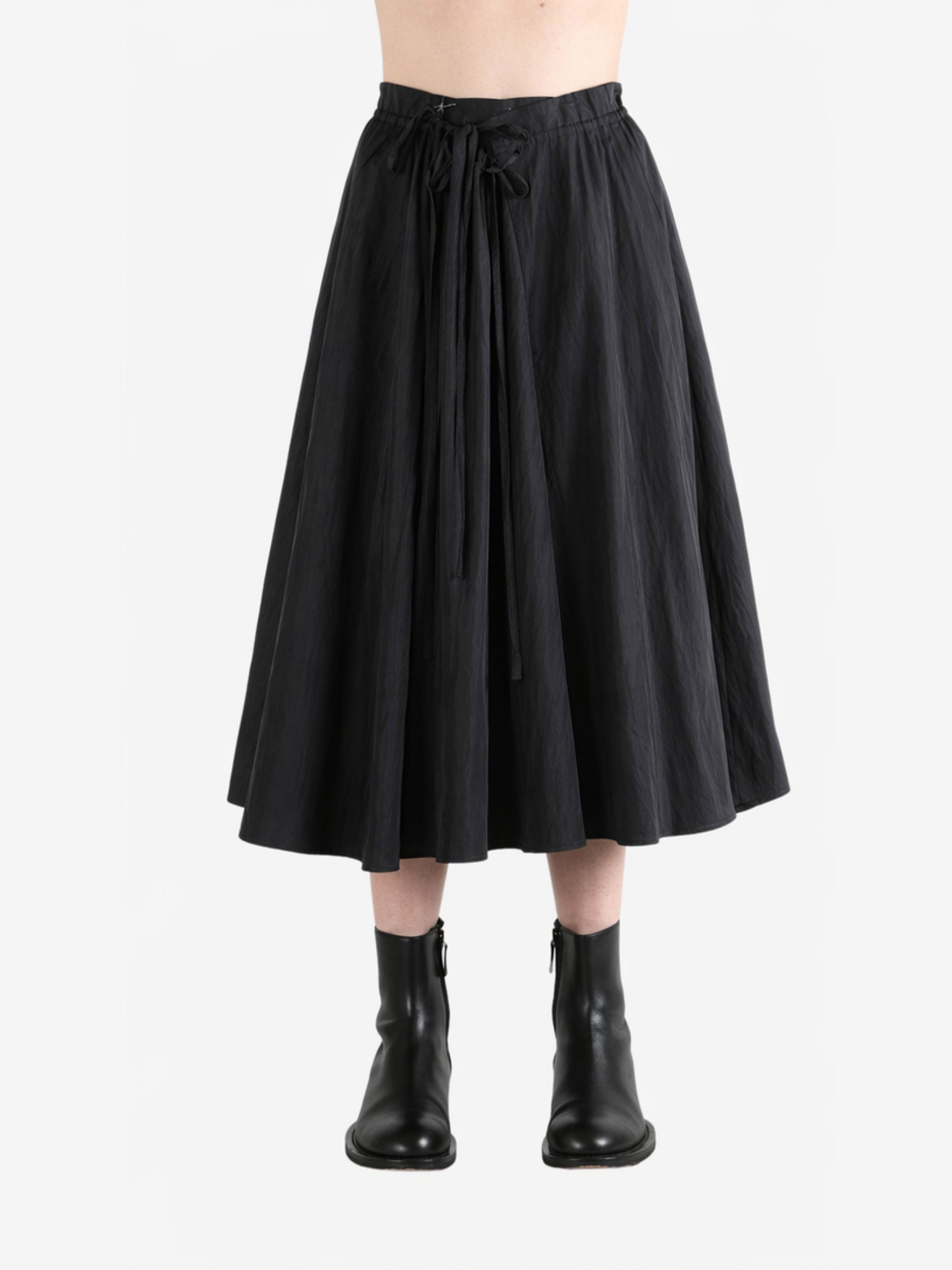 Black skirt worn by a person, showing the skirt fit