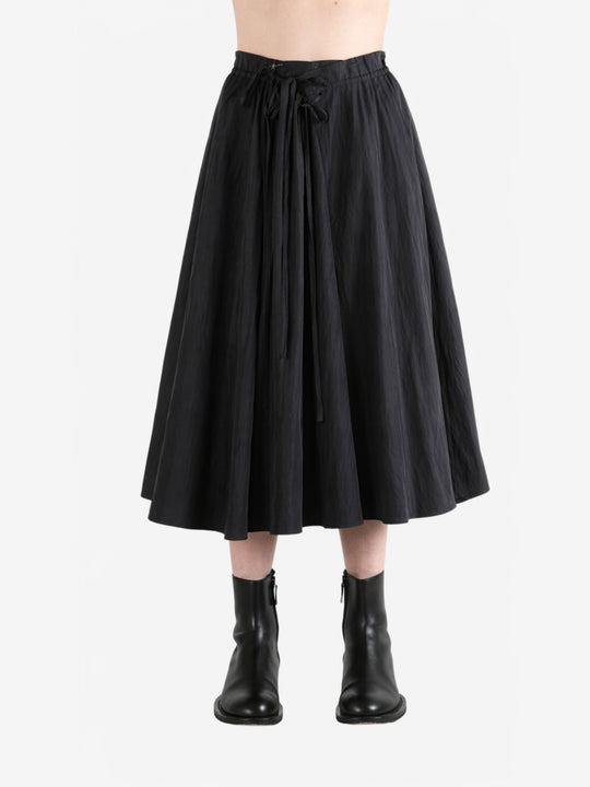 Black skirt worn by a person, showing the skirt fit