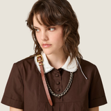 Brown dress worn by a person, showing the dress fit