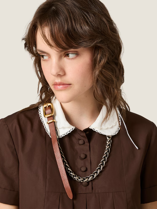 Brown dress worn by a person, showing the dress fit
