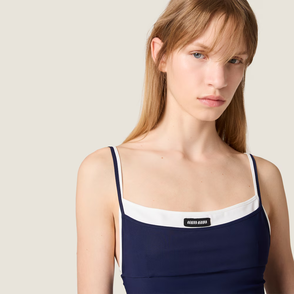 Navy dress worn by a person, showing the dress fit