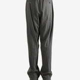 Grey pants worn by a person, showing the pants fit