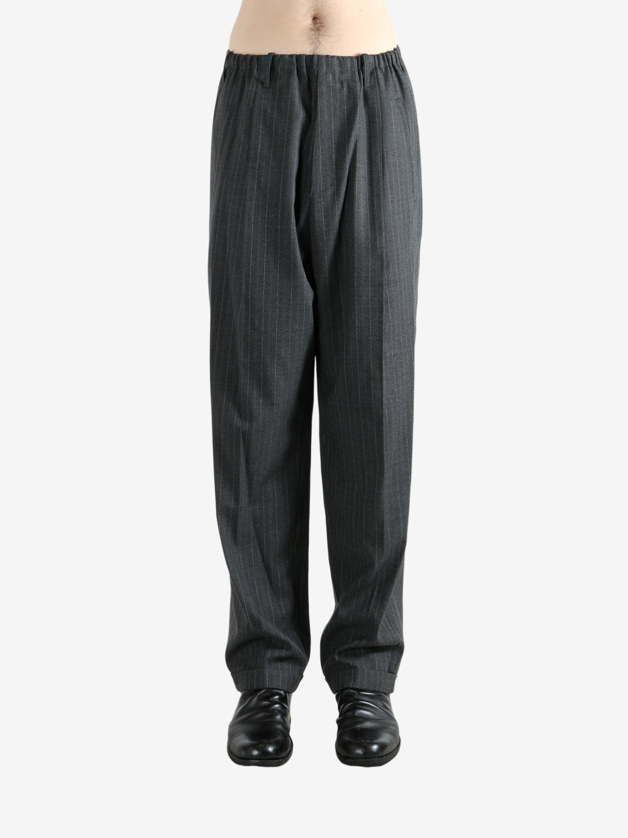 Grey pants worn by a person, showing the pants fit