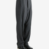 Grey pants worn by a person, showing the pants fit