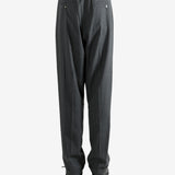 Grey pants worn by a person, showing the pants fit