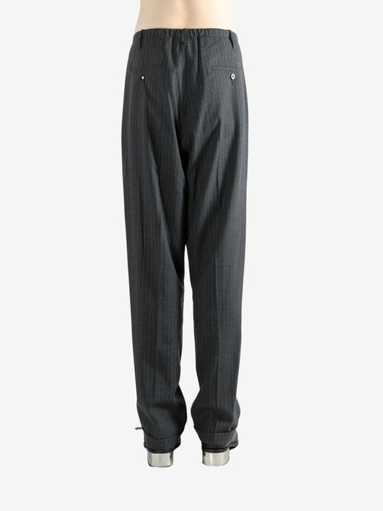 Grey pants worn by a person, showing the pants fit