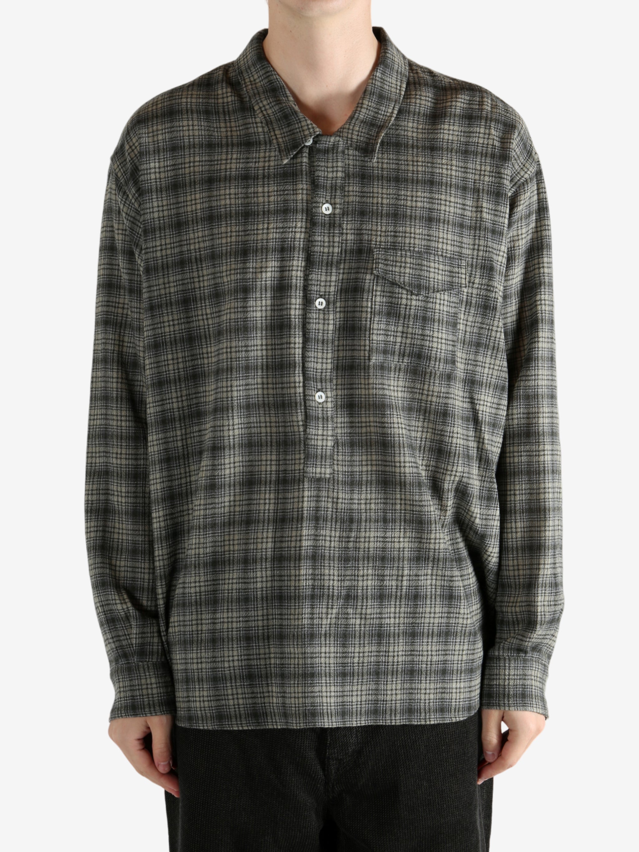 Green shirt, worn by a person, showing the shirt's fit