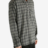 Green shirt, worn by a person, showing the shirt's fit