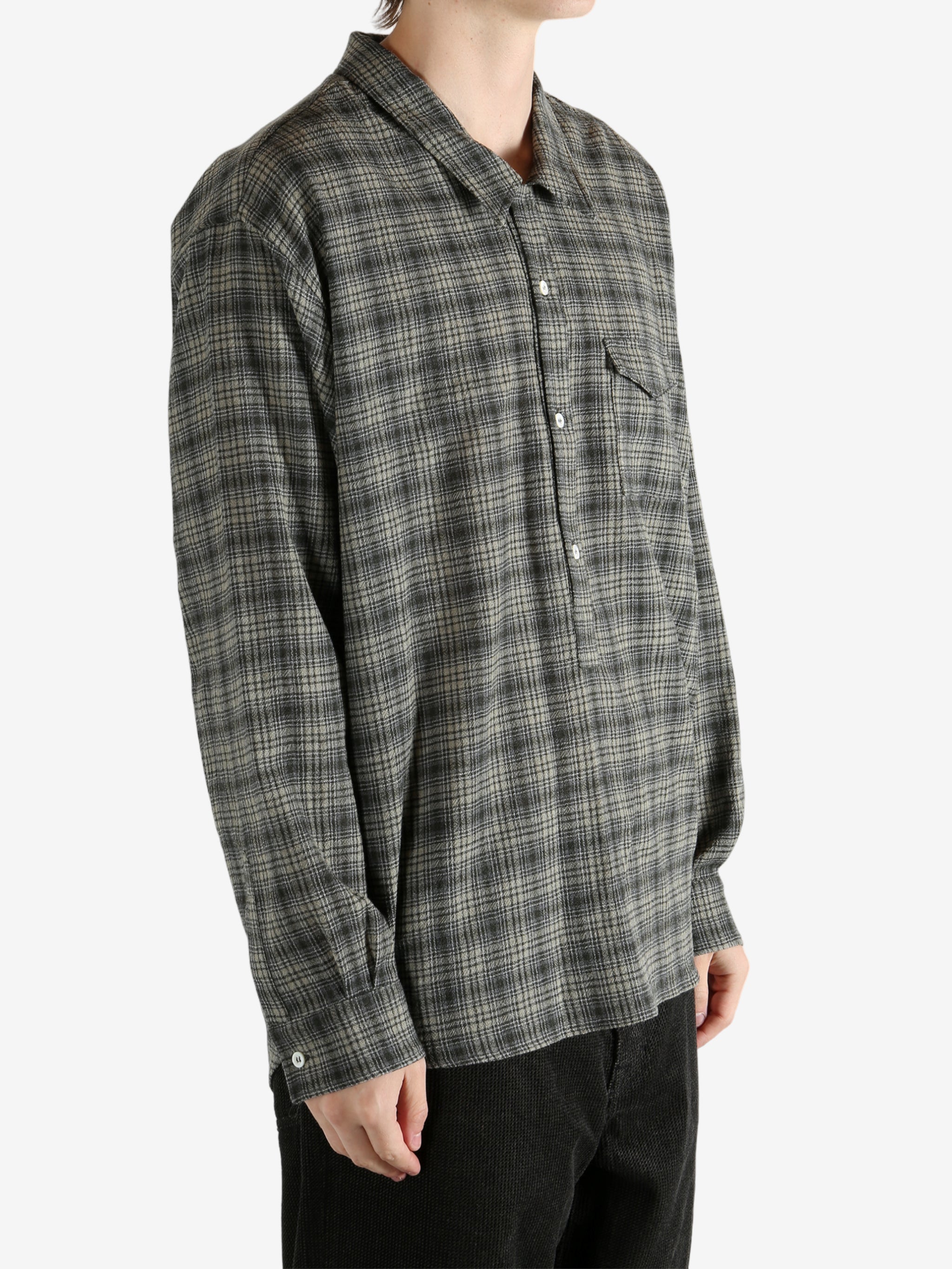 Green shirt, worn by a person, showing the shirt's fit