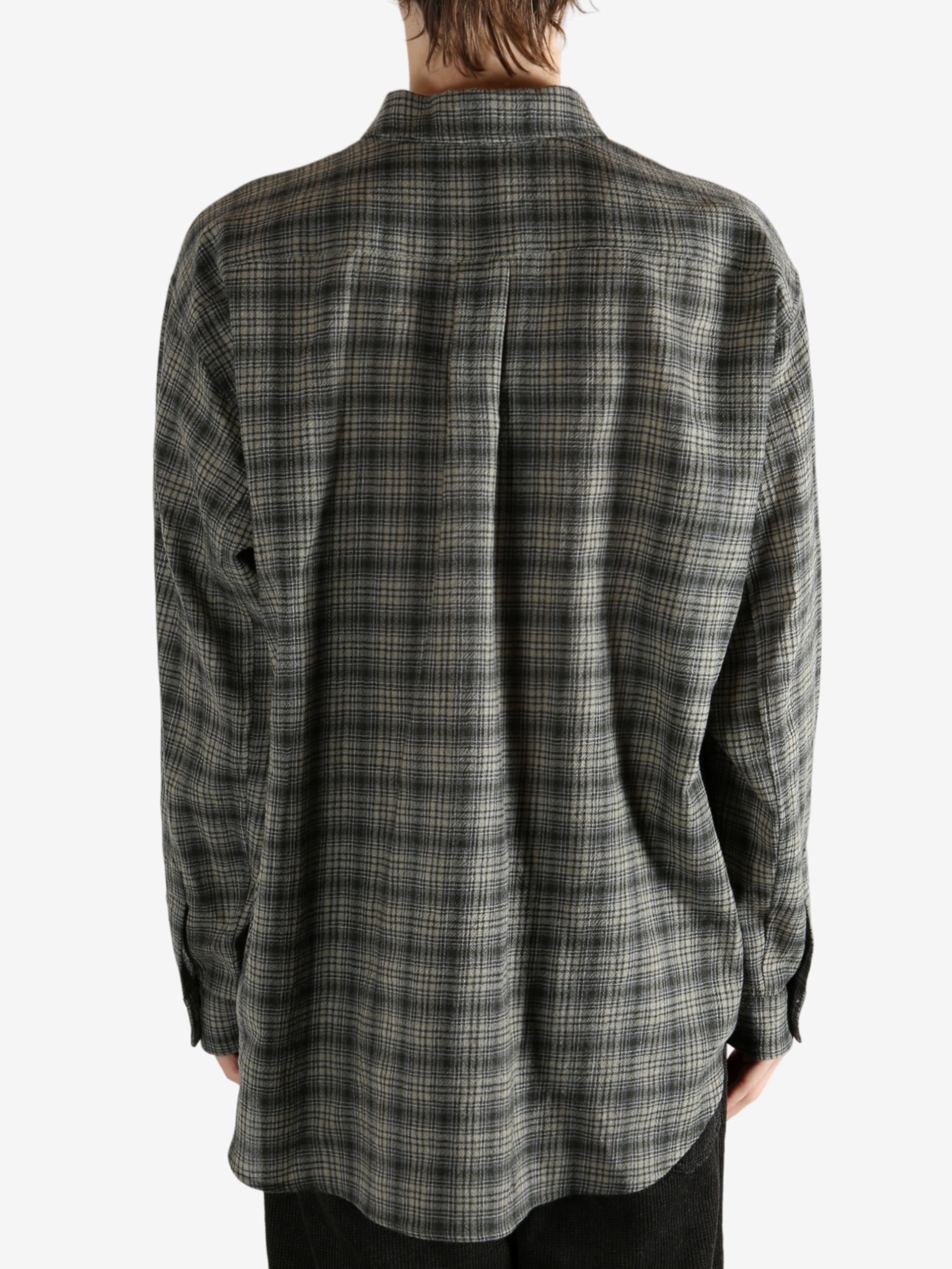 Green shirt, worn by a person, showing the shirt's fit