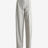 Grey pants worn by a person, showing the pants' fit