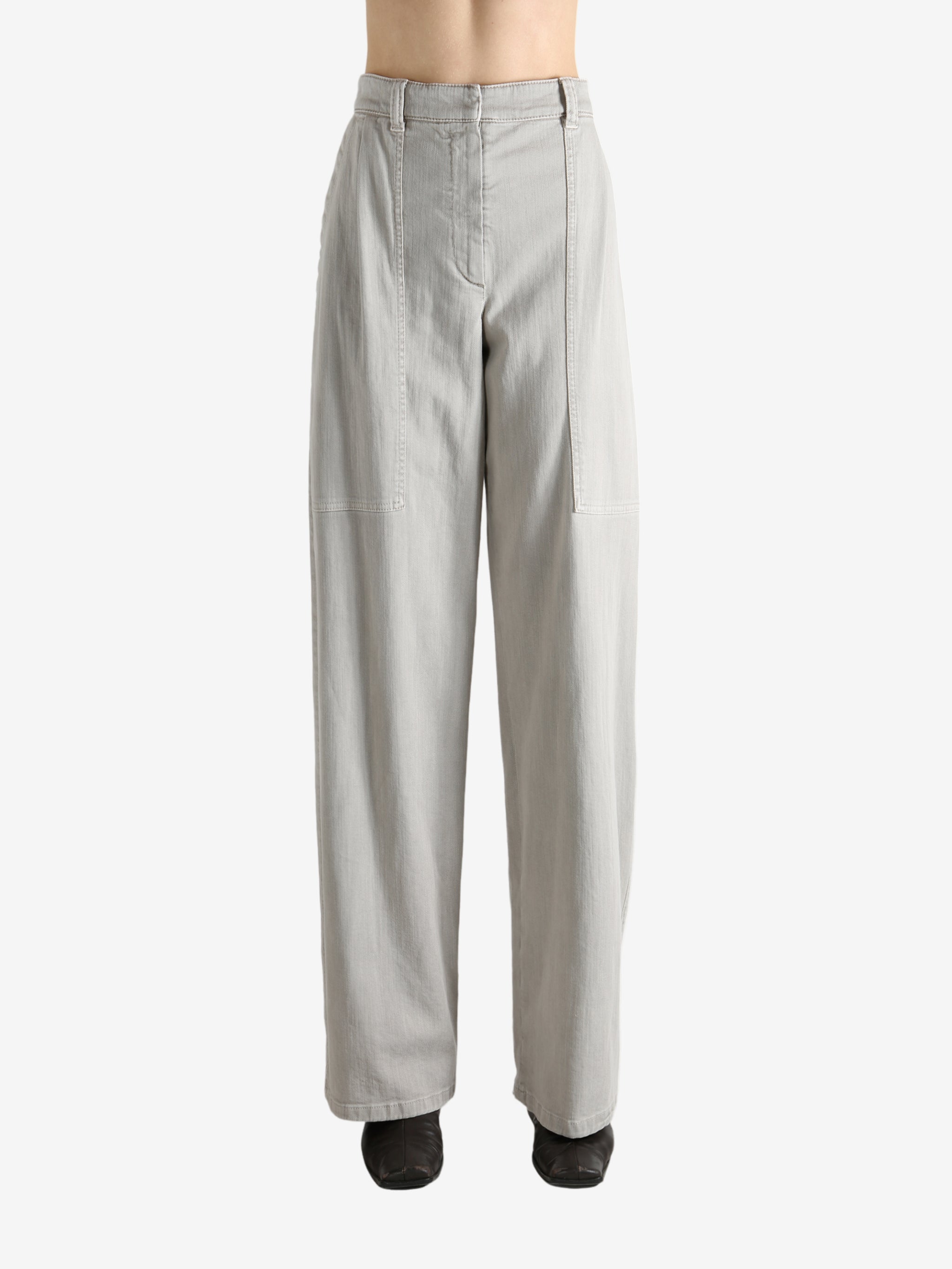 Grey pants worn by a person, showing the pants' fit