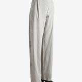 Grey pants worn by a person, showing the pants' fit