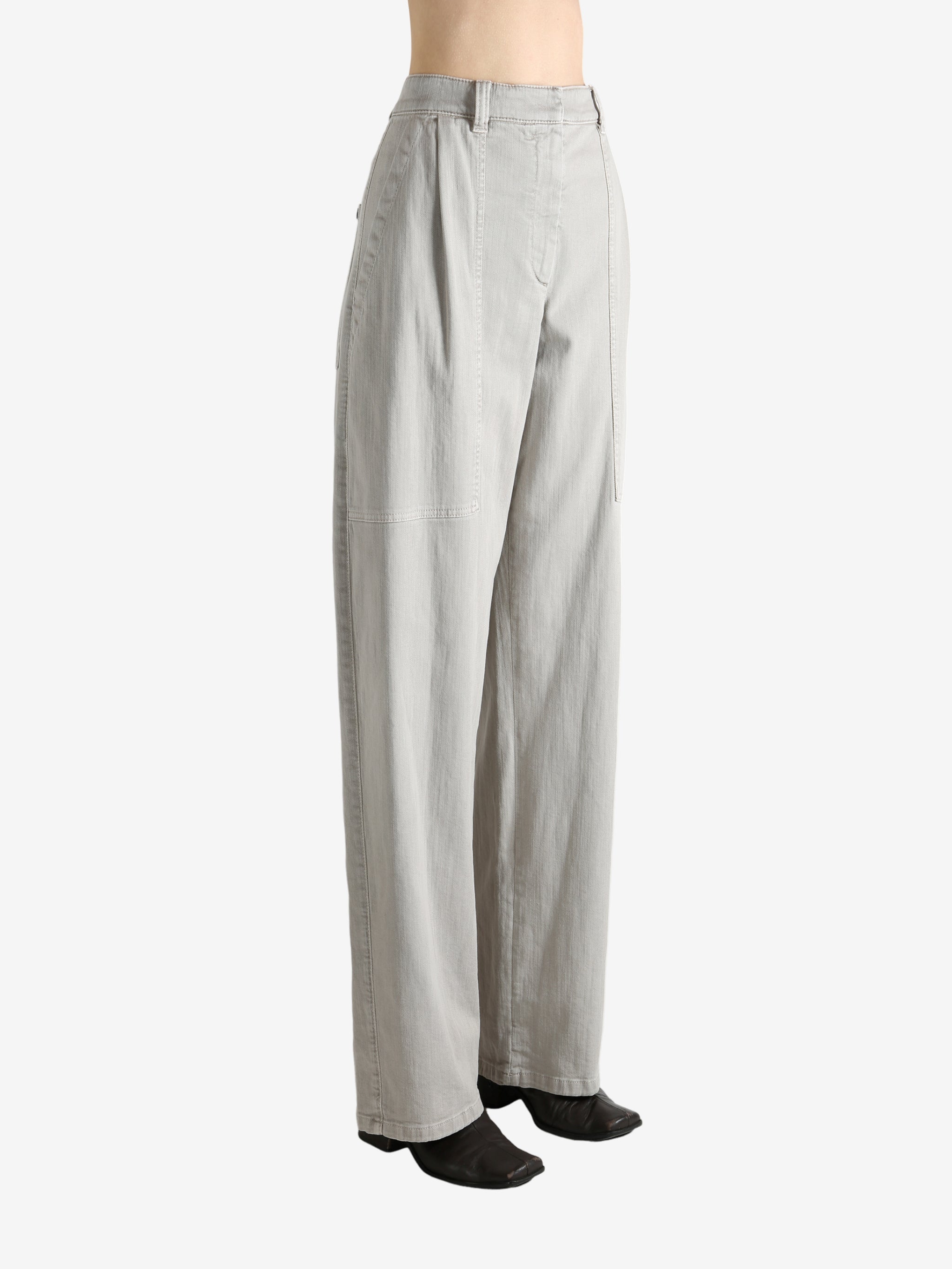 Grey pants worn by a person, showing the pants' fit