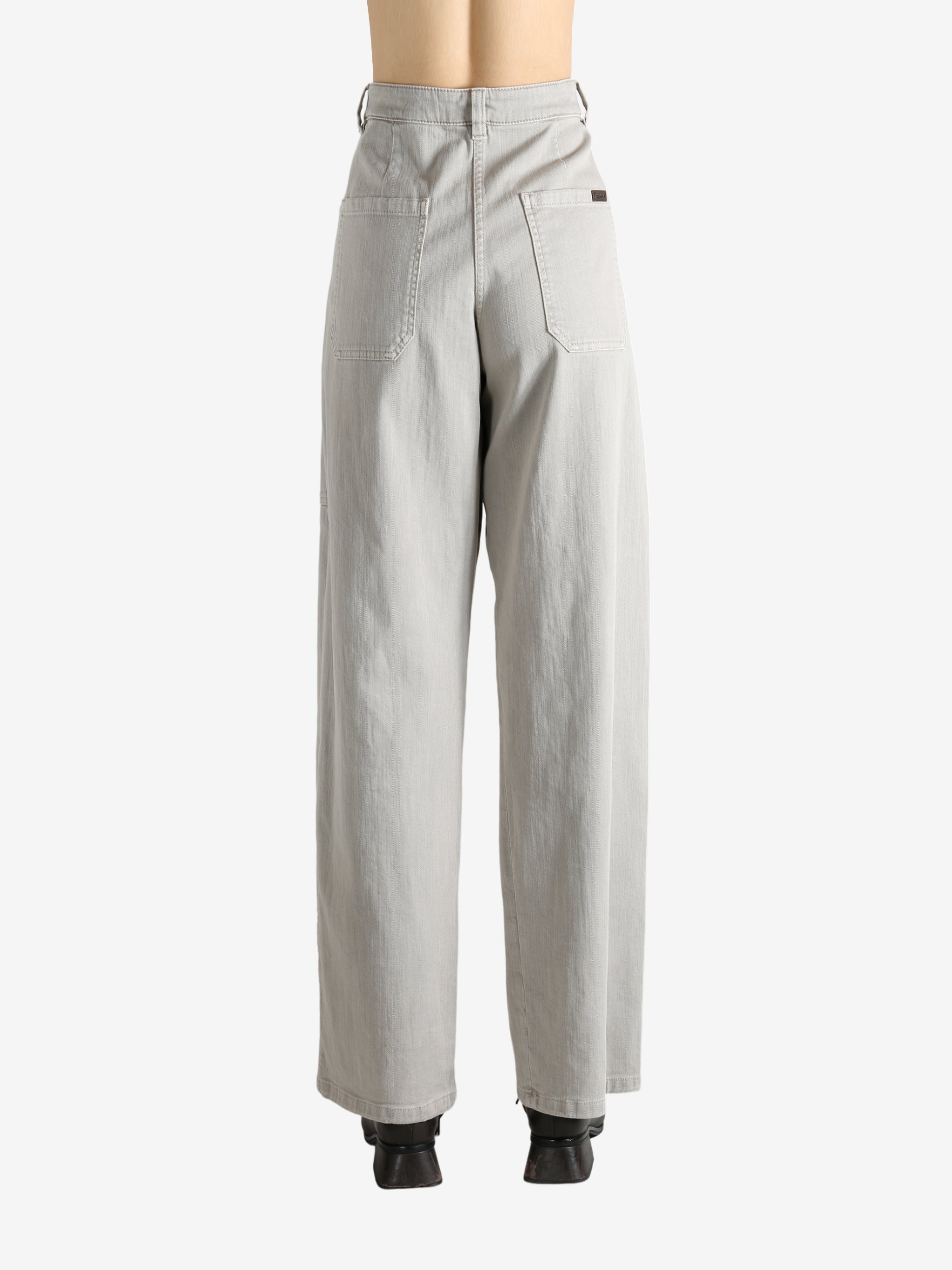 Grey pants worn by a person, showing the pants' fit