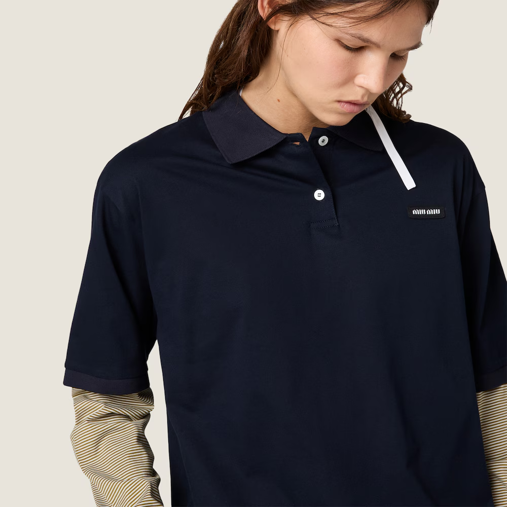 Navy shirt worn by a person, showing the shirt fit
