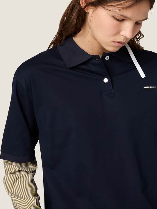 Navy shirt worn by a person, showing the shirt fit