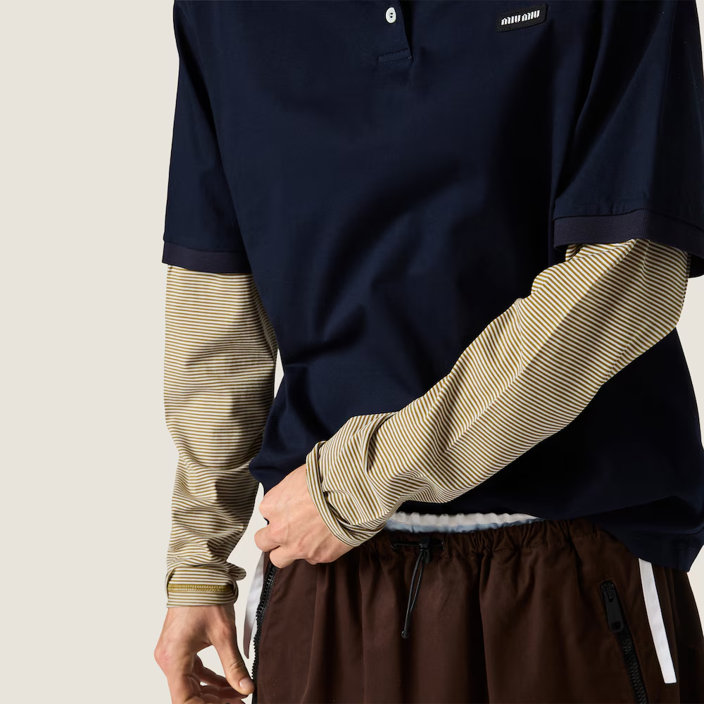 Navy shirt worn by a person, showing the shirt fit