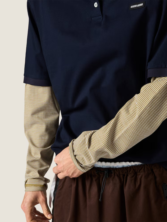 Navy shirt worn by a person, showing the shirt fit