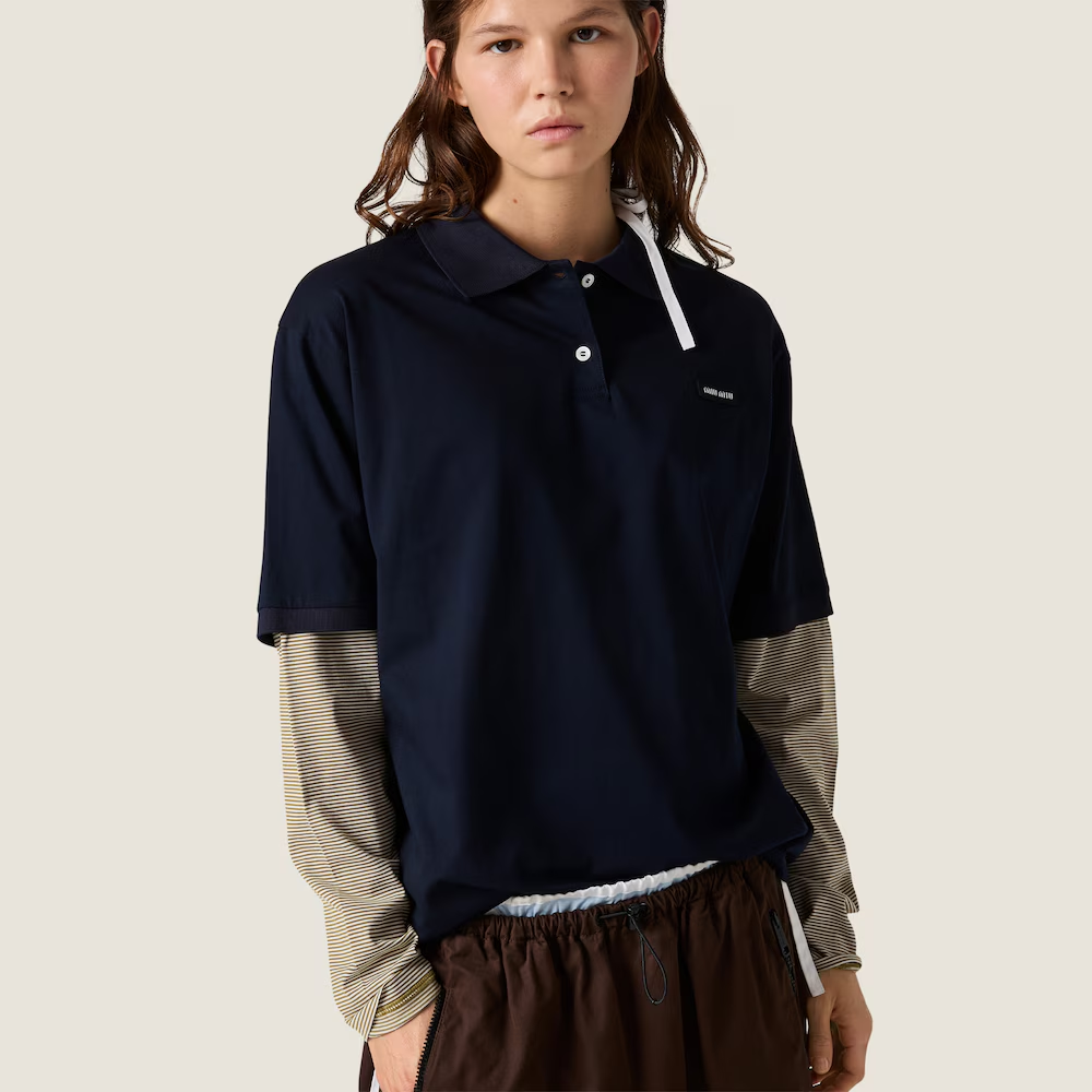 Navy shirt worn by a person, showing the shirt fit